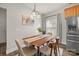 Charming dining room features a wooden table, modern light fixture, and stylish decor at 2624 St Helena Ct, Fort Mill, SC 29715
