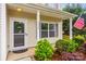 Charming front porch with decorative wreath, plants, and American flag displayed at 2624 St Helena Ct, Fort Mill, SC 29715