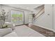 Inviting living room with hardwood floors, large window, and view of the front entry at 2624 St Helena Ct, Fort Mill, SC 29715