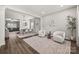Bright living room featuring hardwood floors, neutral color palette, and open floor plan at 2624 St Helena Ct, Fort Mill, SC 29715