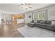 Open-concept living room adjoining kitchen, hardwood floors, and ample natural light at 2624 St Helena Ct, Fort Mill, SC 29715