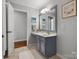 Bathroom with vanity, blue cabinets, large mirror, and tile flooring at 281 Loch Stone St, Fort Mill, SC 29715