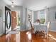 Bright dining area with hardwood floors, chandelier, and backyard view from the large windows at 281 Loch Stone St, Fort Mill, SC 29715