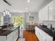 Bright kitchen with white cabinets, granite countertops, eat-in area and stainless steel sink at 281 Loch Stone St, Fort Mill, SC 29715