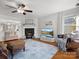 Bright living room features a fireplace, hardwood floors, and comfortable seating area at 281 Loch Stone St, Fort Mill, SC 29715