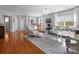 Bright open living room with hardwood floors, elegant chandelier, and neutral decor at 281 Loch Stone St, Fort Mill, SC 29715
