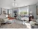 Bright and airy living room featuring hardwood floors, neutral tones, and a chandelier at 281 Loch Stone St, Fort Mill, SC 29715