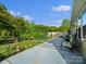 Serene patio surrounded by lush greenery, perfect for outdoor relaxation at 281 Loch Stone St, Fort Mill, SC 29715