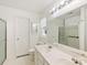 This bathroom has dual sinks, and a glass enclosed shower and toilet at 3022 Willamette Valley Dr, Charlotte, NC 28215