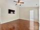 This bedroom features hardwood floors, a TV and neutral wall color at 3022 Willamette Valley Dr, Charlotte, NC 28215
