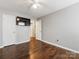 This bedroom features hardwood floors, neutral walls, and a ceiling fan at 3022 Willamette Valley Dr, Charlotte, NC 28215