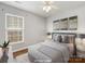 Staged bedroom featuring hardwood floors, neutral walls and decor at 3022 Willamette Valley Dr, Charlotte, NC 28215