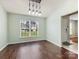 Modern dining area offers wood floors, designer lighting and an open entry at 3022 Willamette Valley Dr, Charlotte, NC 28215
