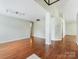 Open living area with wood floors, recessed lighting and white columns at 3022 Willamette Valley Dr, Charlotte, NC 28215
