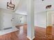 Open-concept living room featuring neutral walls, hardwood floors, decorative lighting, and plenty of natural light at 3022 Willamette Valley Dr, Charlotte, NC 28215