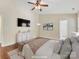 Tranquil main bedroom features a ceiling fan, hardwood floors, and stylish decor at 3022 Willamette Valley Dr, Charlotte, NC 28215