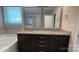 Well-lit bathroom featuring a dual sink vanity with granite countertop, a soaking tub and walk-in shower at 3030 Collin House Dr, Fort Mill, SC 29715