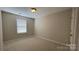 Cozy bedroom featuring neutral paint, carpeted flooring and a window providing natural light at 3030 Collin House Dr, Fort Mill, SC 29715