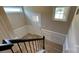 A well lit entryway with decorative moulding and hardwood flooring at 3030 Collin House Dr, Fort Mill, SC 29715