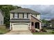 Charming home featuring stone accents, neutral siding, a two-car garage, and well-maintained landscaping at 3030 Collin House Dr, Fort Mill, SC 29715