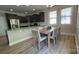 Kitchen features stainless steel appliances, dark cabinets, and a breakfast nook at 3030 Collin House Dr, Fort Mill, SC 29715