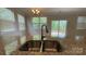Close-up of a stainless steel kitchen sink with granite countertops at 3030 Collin House Dr, Fort Mill, SC 29715