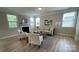 Inviting living room features large windows, a fireplace, and stylish decor at 3030 Collin House Dr, Fort Mill, SC 29715