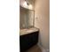 Powder room with granite countertop, dark cabinets and framed mirror at 3030 Collin House Dr, Fort Mill, SC 29715