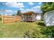 Spacious backyard with a screened-in porch and a wooden privacy fence at 3117 Fraley Church Rd, Gastonia, NC 28054