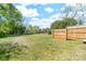 A spacious, green backyard, fenced on one side, with plenty of room to play and enjoy at 3117 Fraley Church Rd, Gastonia, NC 28054