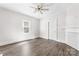 Bright bedroom featuring wood-look floors and a ceiling fan at 3117 Fraley Church Rd, Gastonia, NC 28054