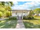 A quaint one-story home with a covered porch and walkway leading to the front door at 3117 Fraley Church Rd, Gastonia, NC 28054