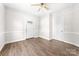A bright and airy living room with new floors and a classic ceiling fan at 3117 Fraley Church Rd, Gastonia, NC 28054