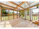 Spacious screened-in porch with wooden floors, a metal roof, and outdoor views at 3117 Fraley Church Rd, Gastonia, NC 28054