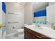 Neutral full bathroom with vanity and blue shower curtain for a modern touch at 3908 Brittany Ct, Indian Trail, NC 28079