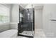 Elegant bathroom featuring soaking tub, glass shower, and double sink vanity at 3908 Brittany Ct, Indian Trail, NC 28079