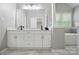 Stylish bathroom with double vanity, neutral walls, and a column feature at 3908 Brittany Ct, Indian Trail, NC 28079