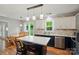Eat-in kitchen with stainless appliances, island seating, and a backyard view at 3908 Brittany Ct, Indian Trail, NC 28079