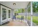 Inviting screened porch with chairs and table perfect for outdoor living at 3908 Brittany Ct, Indian Trail, NC 28079