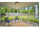 Relaxing screened porch with seating offers a peaceful view of the backyard at 3908 Brittany Ct, Indian Trail, NC 28079