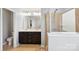 Bathroom with double sink vanity with large mirror and a walk-in shower with glass door at 4011 Black Walnut Way, Indian Land, SC 29707