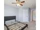 This bedroom features neutral walls, carpet floors, and a ceiling fan, and doors to other spaces at 4011 Black Walnut Way, Indian Land, SC 29707