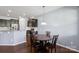 Inviting dining area connected to the kitchen with dark cabinets and stainless steel appliances at 4011 Black Walnut Way, Indian Land, SC 29707