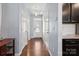 Hallway featuring hardwood floors, neutral walls, and access to various rooms at 4011 Black Walnut Way, Indian Land, SC 29707