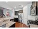 A kitchen boasts granite countertops, stainless steel appliances, and hardwood floors at 4011 Black Walnut Way, Indian Land, SC 29707