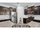 Contemporary kitchen with stainless steel appliances, dark cabinetry, and a subway tile backsplash at 4011 Black Walnut Way, Indian Land, SC 29707