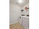Functional laundry room with a modern washer and dryer, plus a storage shelf for supplies at 4011 Black Walnut Way, Indian Land, SC 29707