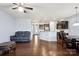 Open-concept living space with wood floors, fireplace, and view of kitchen and dining areas at 4011 Black Walnut Way, Indian Land, SC 29707
