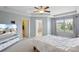 Spacious main bedroom with neutral walls, a ceiling fan, a window, and doors to a closet and bathroom at 4011 Black Walnut Way, Indian Land, SC 29707