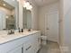 Modern bathroom with double sinks and a glass-enclosed shower at 417 Tristram Ln, Charlotte, NC 28205
